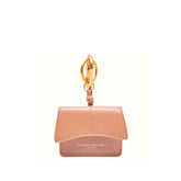 Portachiavi rosa Airpod502 di Gianni Chiarini appoggiato su fondo neutro