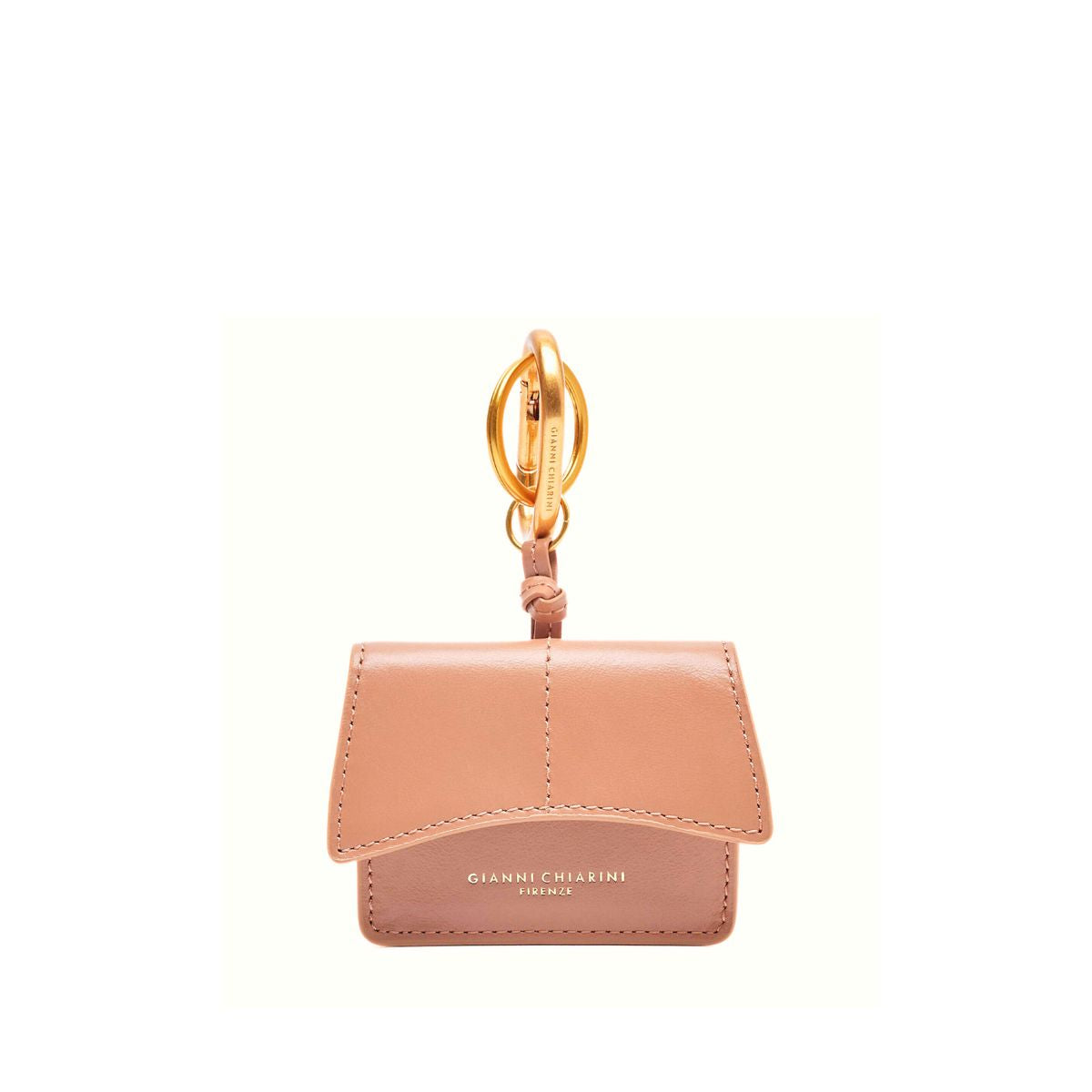 Portachiavi rosa Airpod502 di Gianni Chiarini appoggiato su fondo neutro