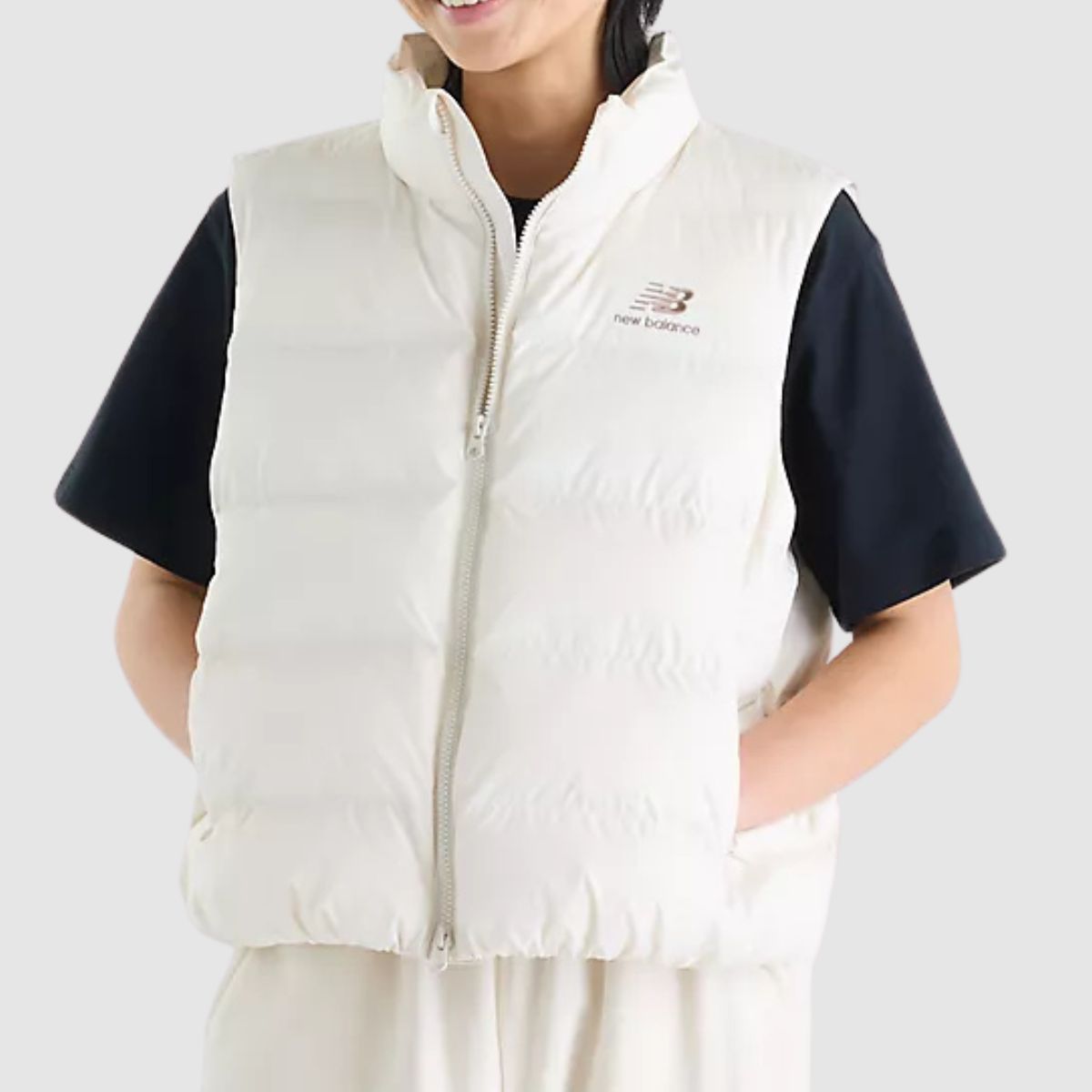 NEW BALANCE PIUMINO GILET WJ62O4EX PANNA